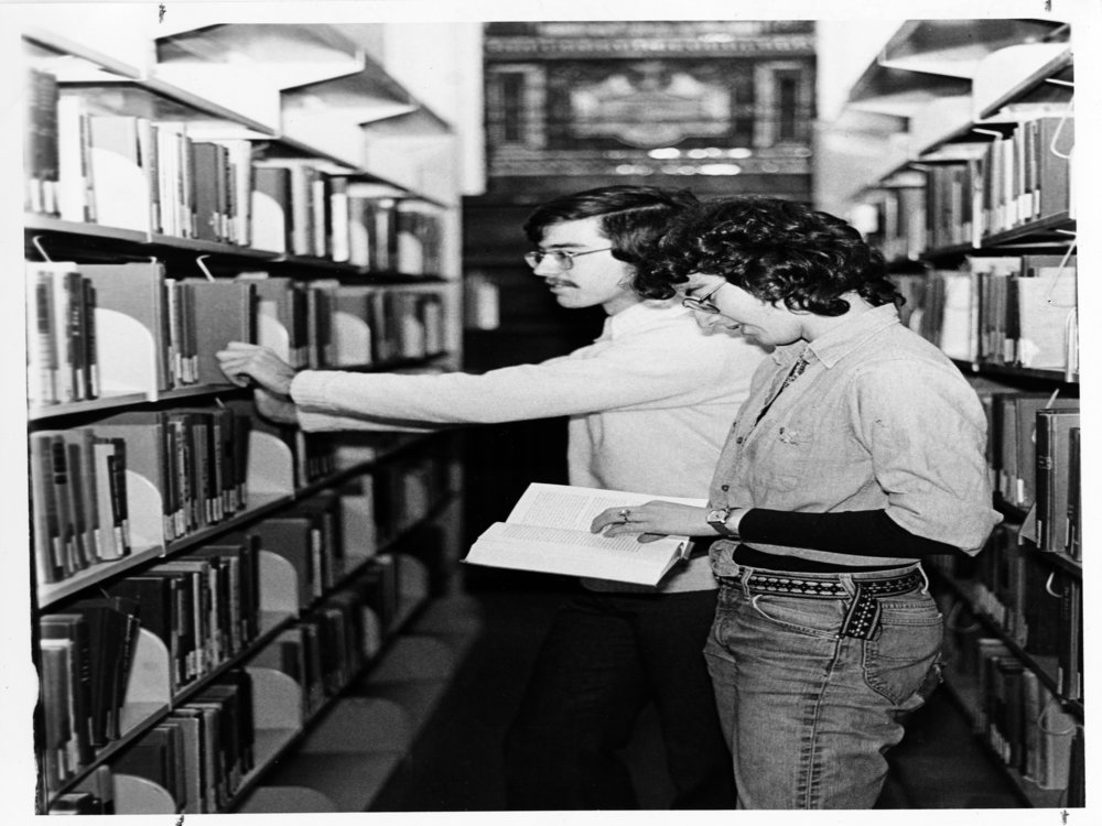 two unidentified students in the library vintage image